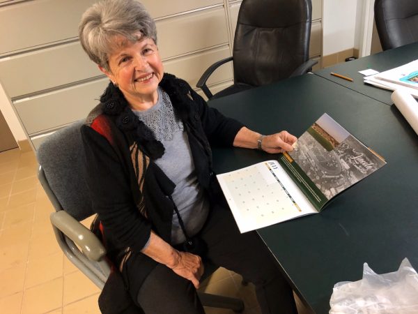 Ruth Smith of the FLH with a calendar.