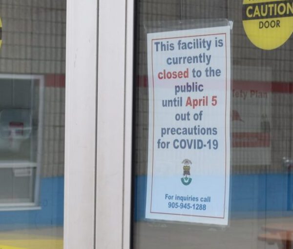 A sign posted to the door to the Peach King Arena describes the facility's closure.