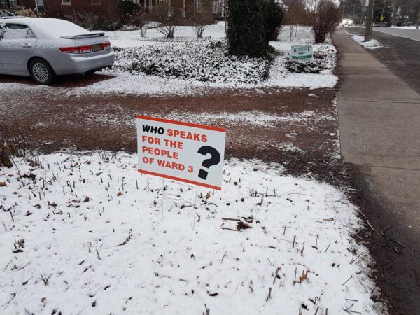 A lawn sign that reads: "Who speaks for the people of Ward 3?"